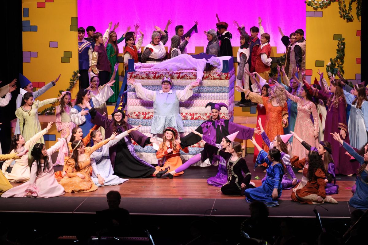 Burnett cast on stage during the final number